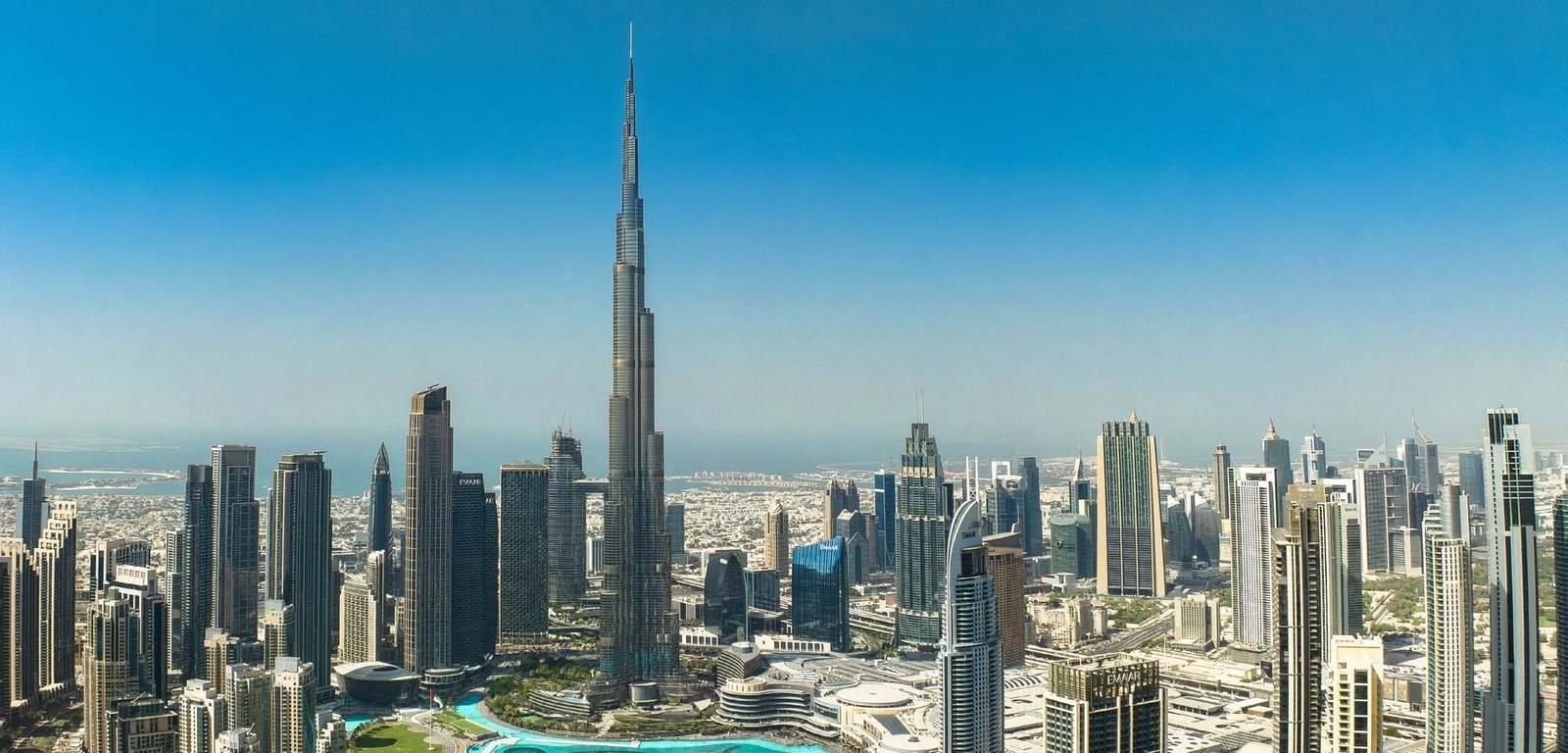 Aerial daytime view of the tower's position beside Burj Khalifa and the Water Canal